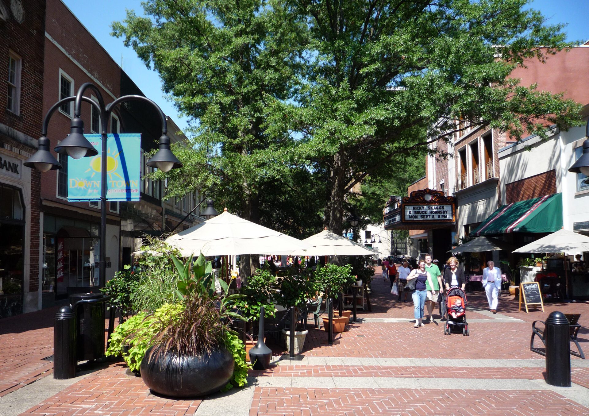 a brick sidewalk with people walking