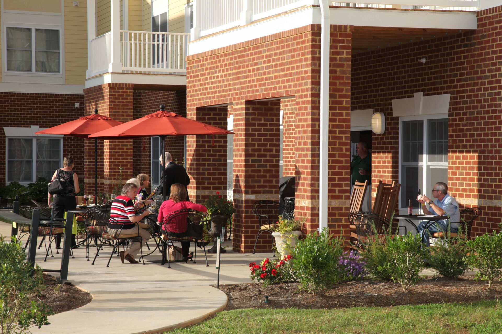 a group of people sitting outside of a building